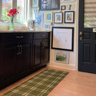 double door size green and white classic plaid doormat inside placed near cabinets