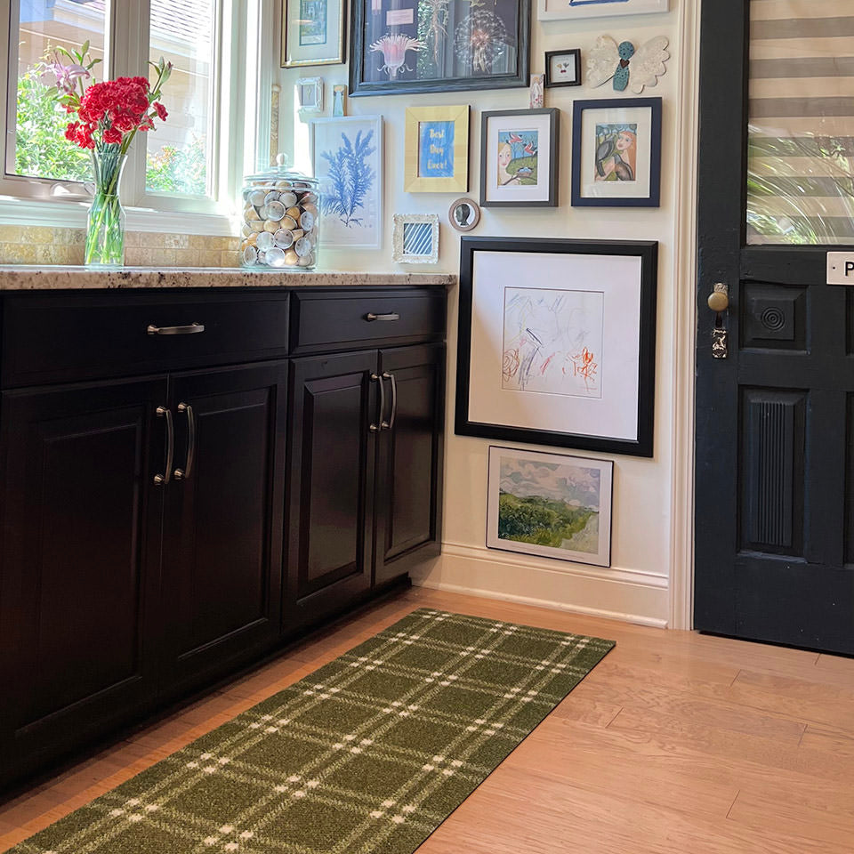 double door size green and white classic plaid doormat inside placed near cabinets