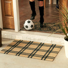 single door classic plaid doormat in coir and black in front of open front door