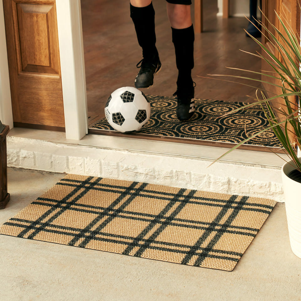single door classic plaid doormat in coir and black in front of open front door