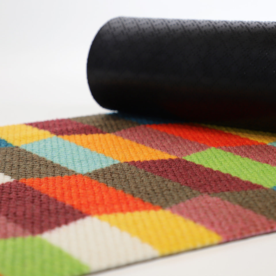 colorful tulips mat with corner rolled over to show black rubber slip-resistant backing