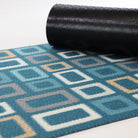 Rubber backing on geometric square aqua doormat