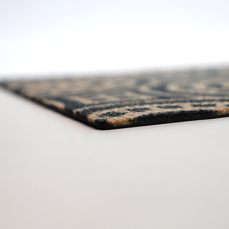 Close up of low profile view of Medallions doormat in coir and black