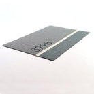 Angle shot of Modern Main personalized doormat with house number