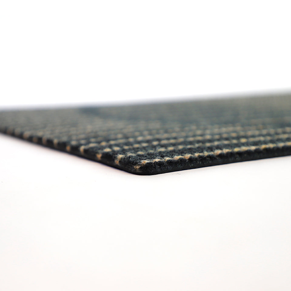 Low profile shot of non shedding doormat in black and tan