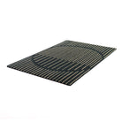 Angled shot of geometric circle and line doormat in black and wheat color