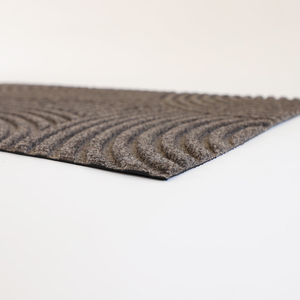 Put Your Records On is a bi-level mat that scrapes shoes and boots clean of dirt, sand, mud, and snow. A modern looking doormat made in the USA with recycled materials.