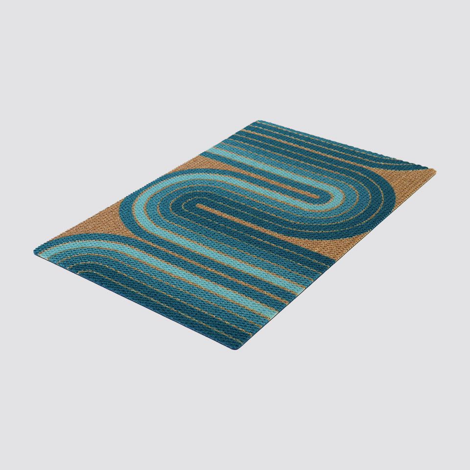 Angled shot of our MCM Retro Vibes doormat shown in aqua and coir. Mid century modern design for a nostalgic retro look with a modern take