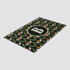 Angle shot of Spring Blooms green and yellow monogrammed doormat personalized with your initial.