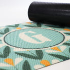 Rubber backing shown on our Spring Blooms monogrammed doormat.  A bright floral doormat monogrammed with your initial for a customized look