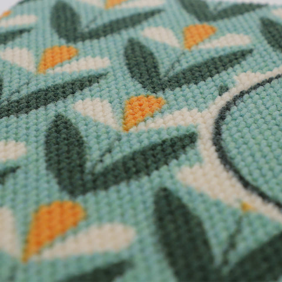 Close up of Spring Blooms floral doormat in aqua green and yellow.  Monogrammed doormats create a customized look personalized for your door!