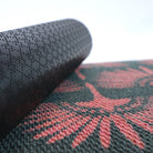 Close up of rubber backing on our Tailfeathers modern crane doormat.  Rubber backing on our doormats help prevents slipping and sliding.