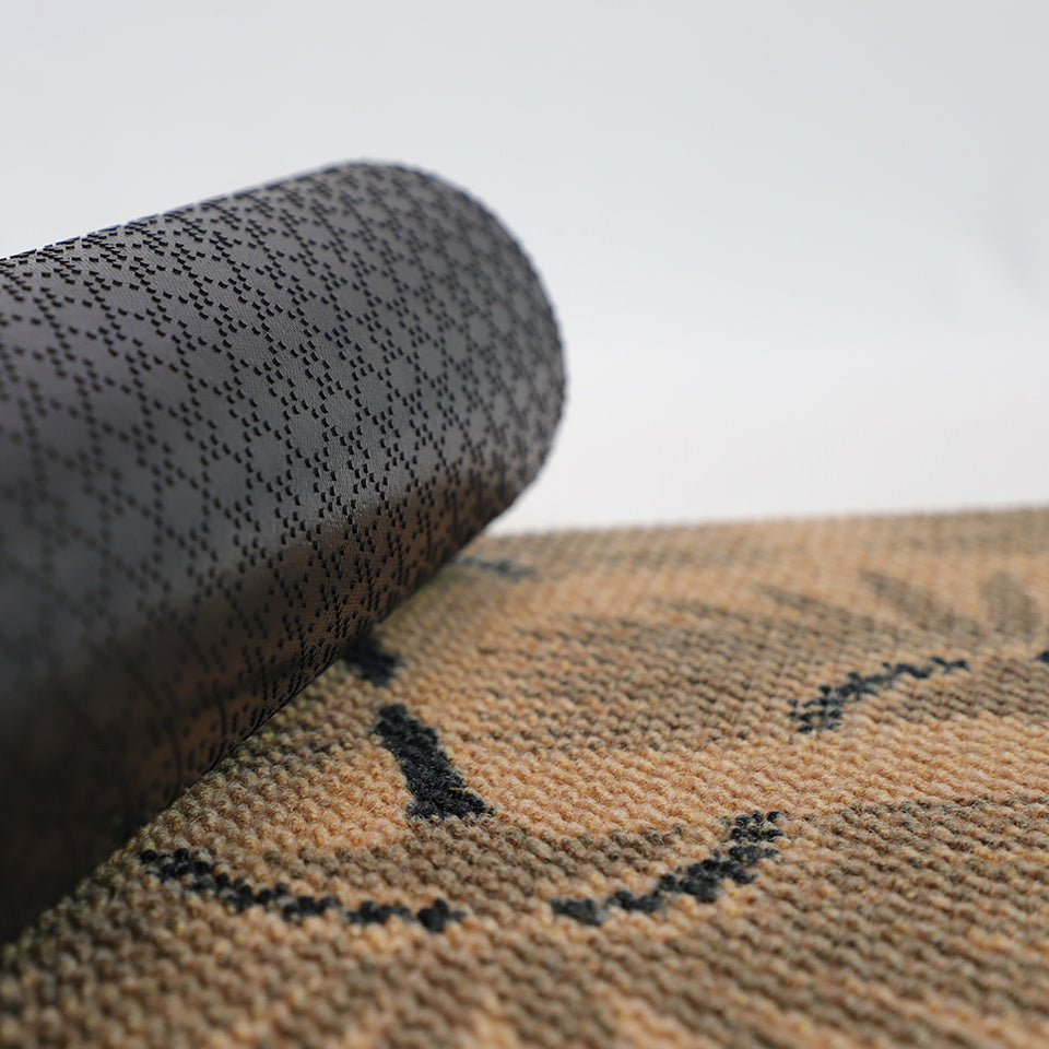 Rubber backing shown on Tailfeathers coir.  Rubber backing helps prevent slips on our low profile doormats.