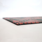 Low profile view of our Tailfeathers doormat in pink and grey.  Low profile doormats help prevent tripping hazards.