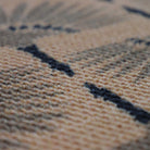 Close up of tailfeathers doormat in tan, coir, and black.  Stain resistant non shedding fibers make this the best doormat you'll ever own!