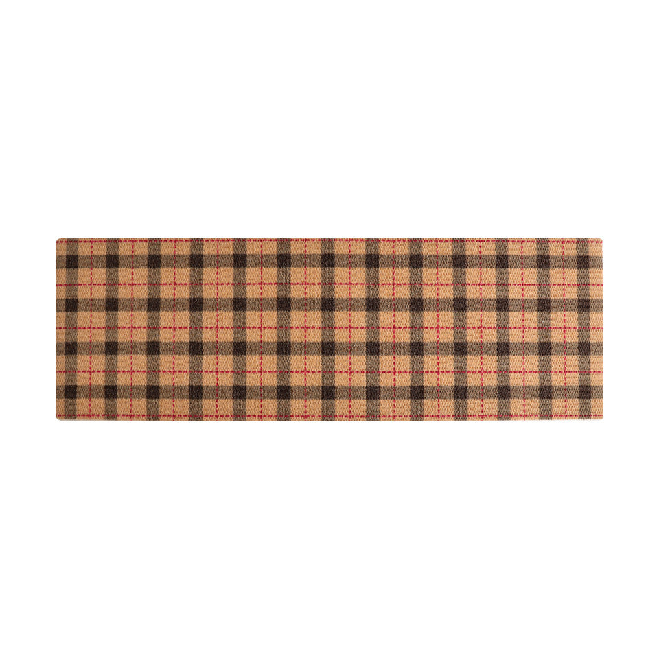 Tattersall plaid in tan, black, and pops of red shown in a double door sized doormat.