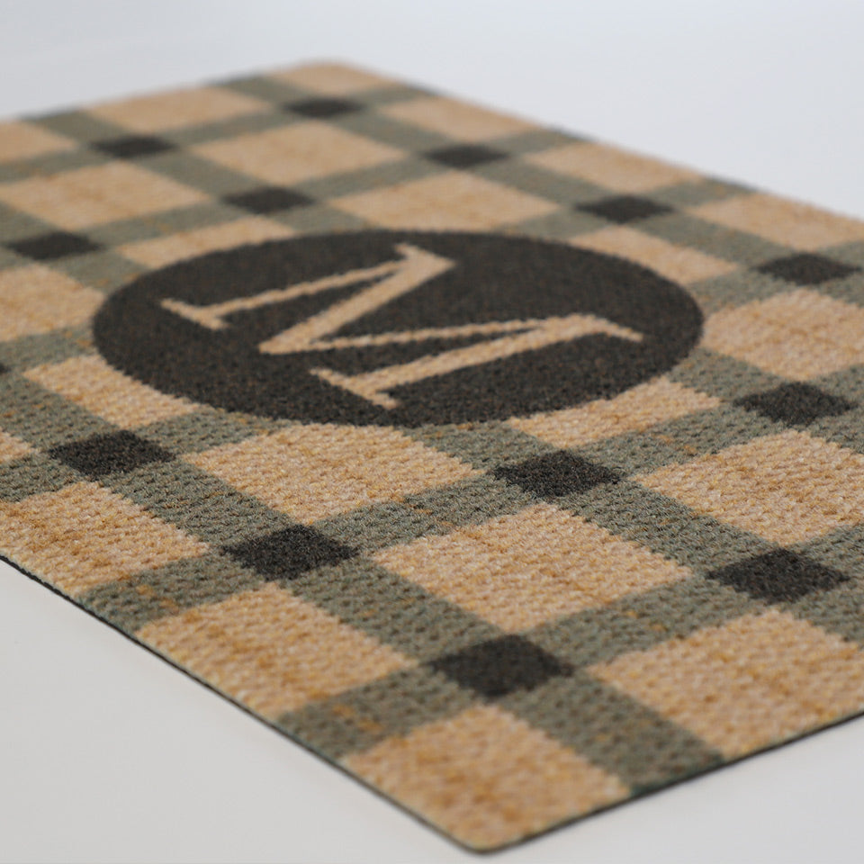 Monogrammed black and tan plaid doormat personalized with your initial.