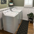double door due north doormat placed inside in front of washing machine and dryer