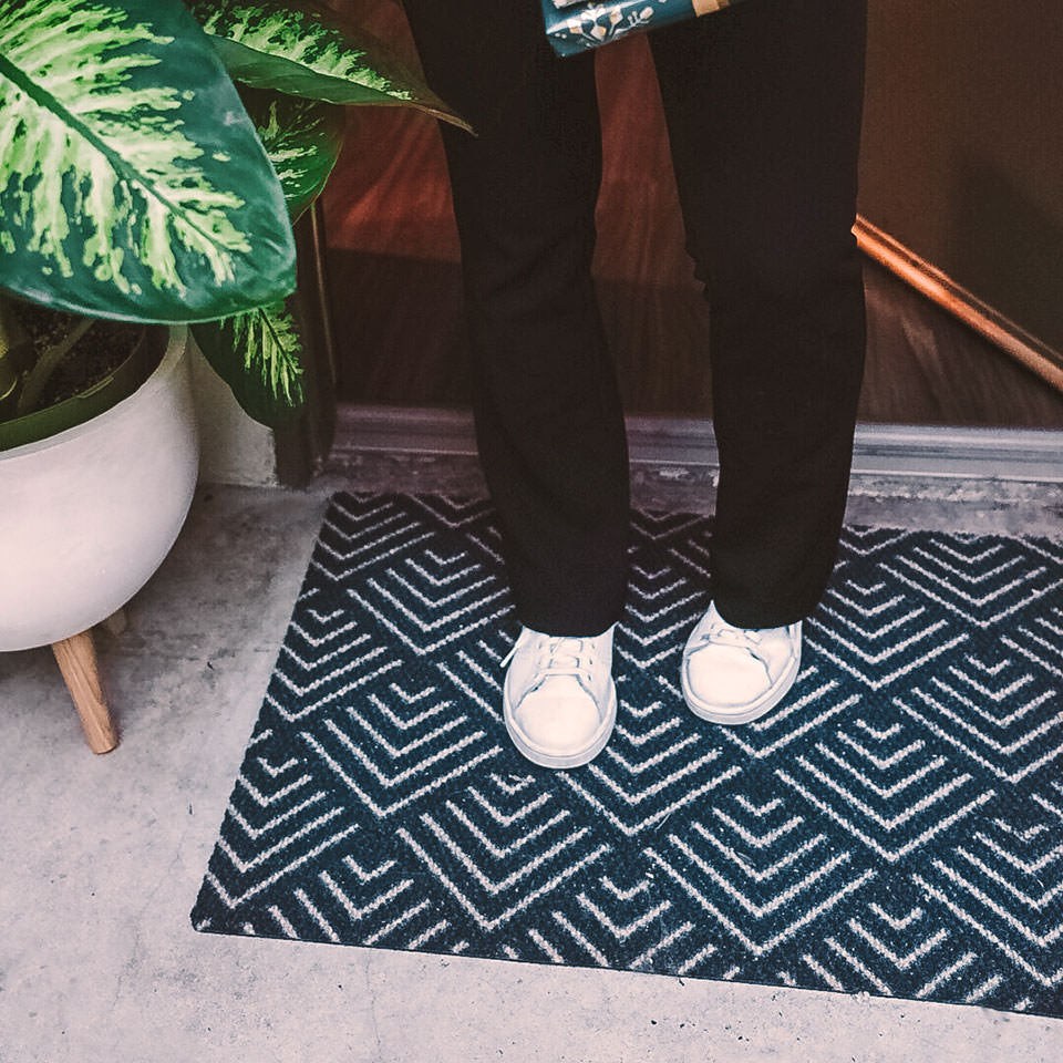 single size due north doormat outside front entryway