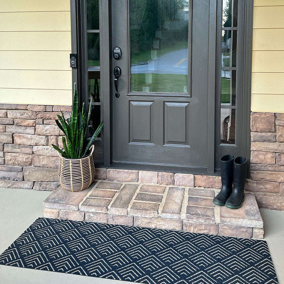 double door size due north doormat placed in front of step at front door entryway