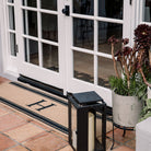 Coir and black monogram personalized doormat with initial and stripes for double door