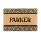 Single door size Argyle mat personalized with last name across the center of the mat in brown font on coir background