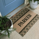 Argyle personalized mat with last name "Perker" in front door entryway.