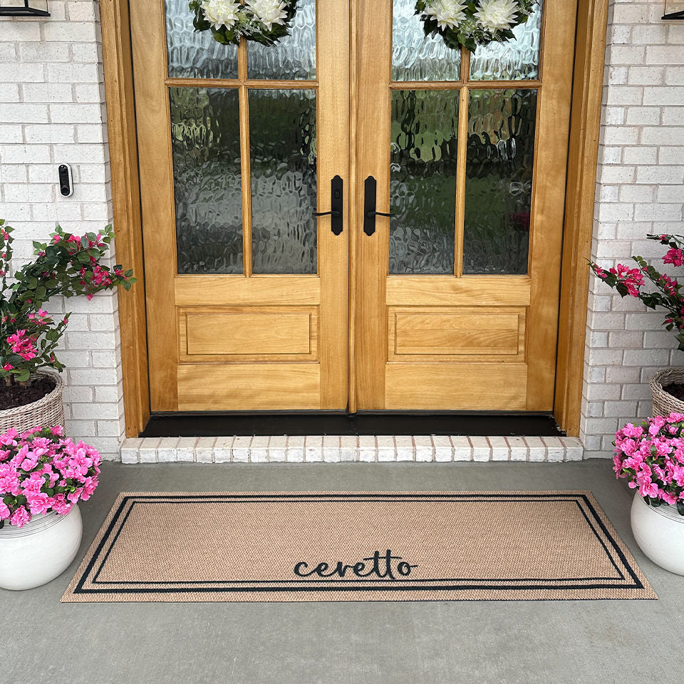 Double door Around The Block Neighburly coir mat personalized with the last name Ceretto.