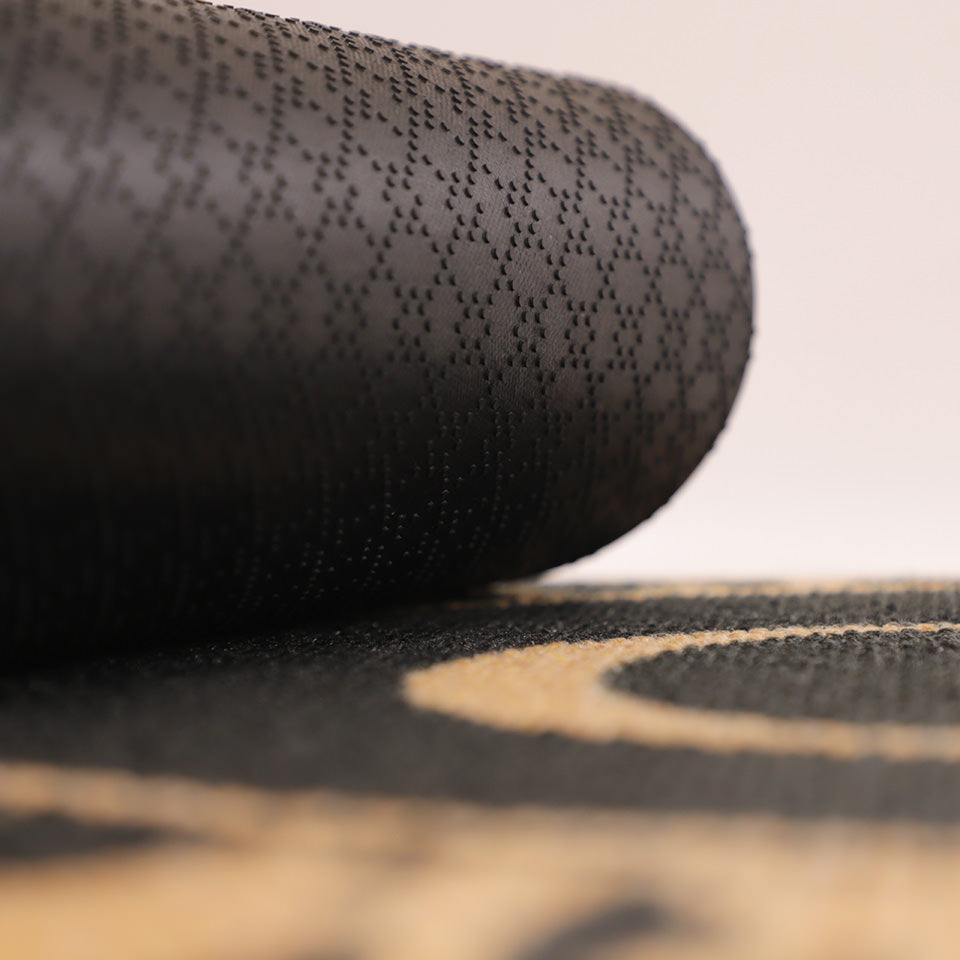 Dahlia mat rolled on to itself, showing the powerful, gripping rubber backing