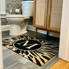 Neighburly's monogramed Dahlia mat in a bathroom; low-profile, no skid, made in the USA.