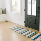 Double door Everly Stripe doormat at the front door entrance of a home.