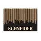 Overhead single door Fall in Line mat personalized name in white at the bottom with vertical coir lines staggered above.