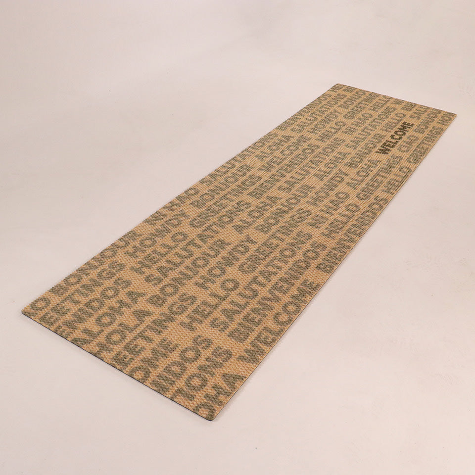 Double door angled Global Greetings mat army colored text on coir repeating bilingual greetings with one black hello text