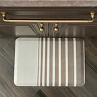 Overhead images of Asymmetrical Stripe Happy Feet comfort mat in a brown colored kitchen with gold accents.