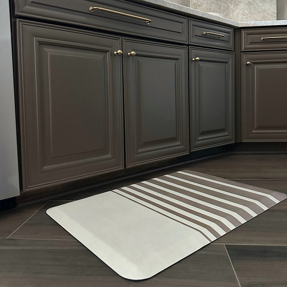 Happy Feet Asymmetrical Stripe kitchen comfort mat with a wipeable surface.