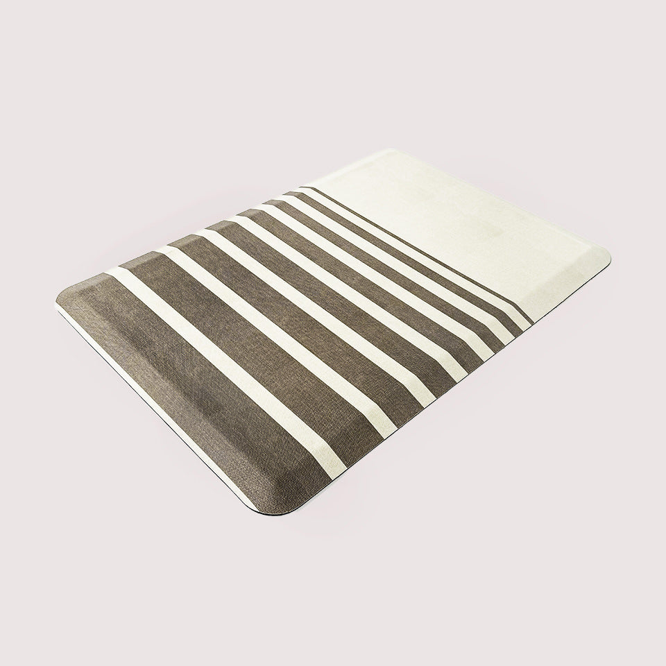High-quality anti-fatigue mat with dark brown/light beige stripes in various sizes on a cream colored background.