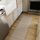 A waterproof Beaded Plaid runner mat in a kitchen for comfort and easy cleaning from spills and messes