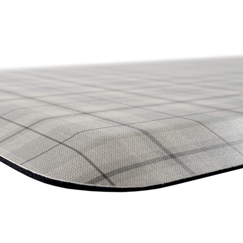 Happy Feet’s cream Brisbane Plaid anti-fatigue mat at an angle showing for its beveled edges for an easier transition.