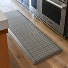 Brisbane Plaid anti fatigue runner mat in cream in a kitchen for standing, cooking comfort