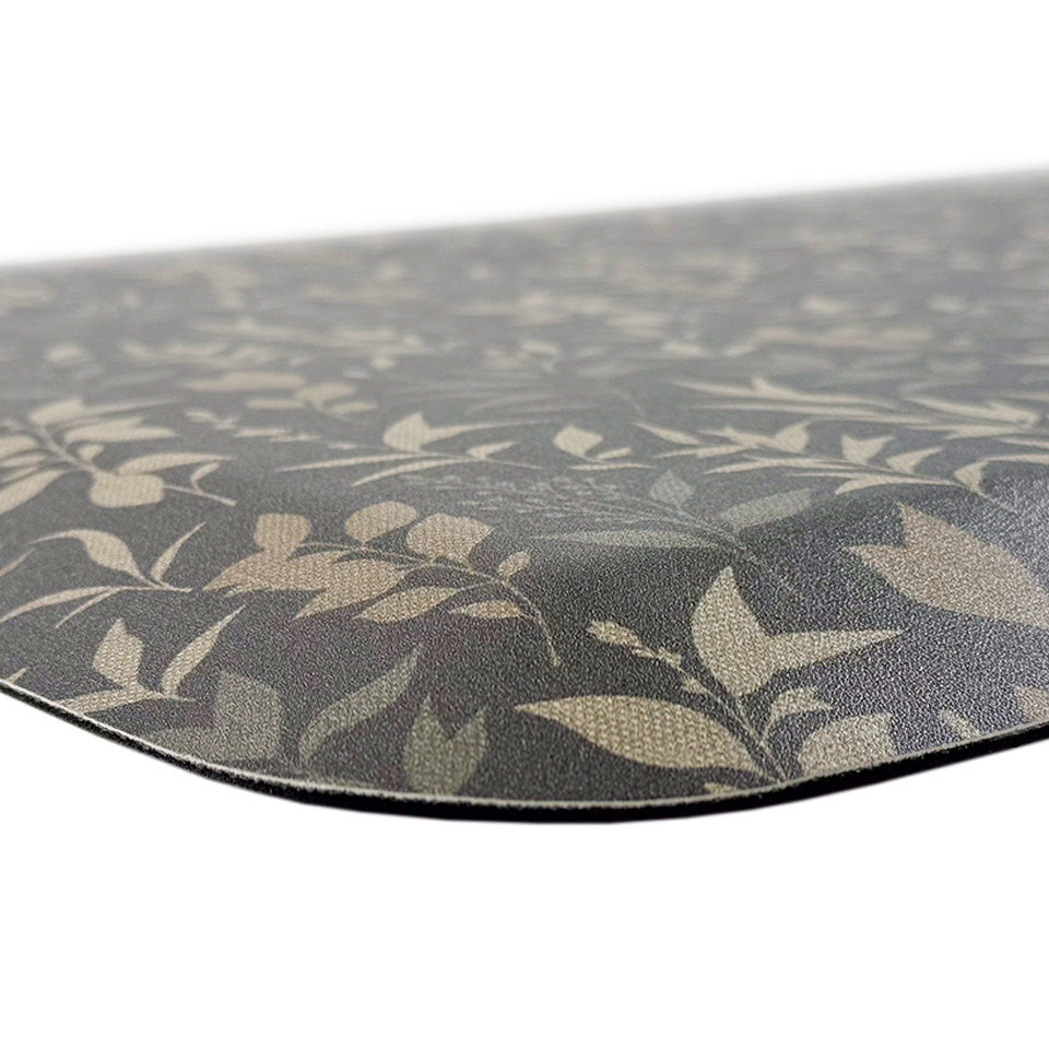 Happy Feet’s Ditsy Floral anti-fatigue mat with sloped, beveled edges for a smooth transition and comfortable foam backing.