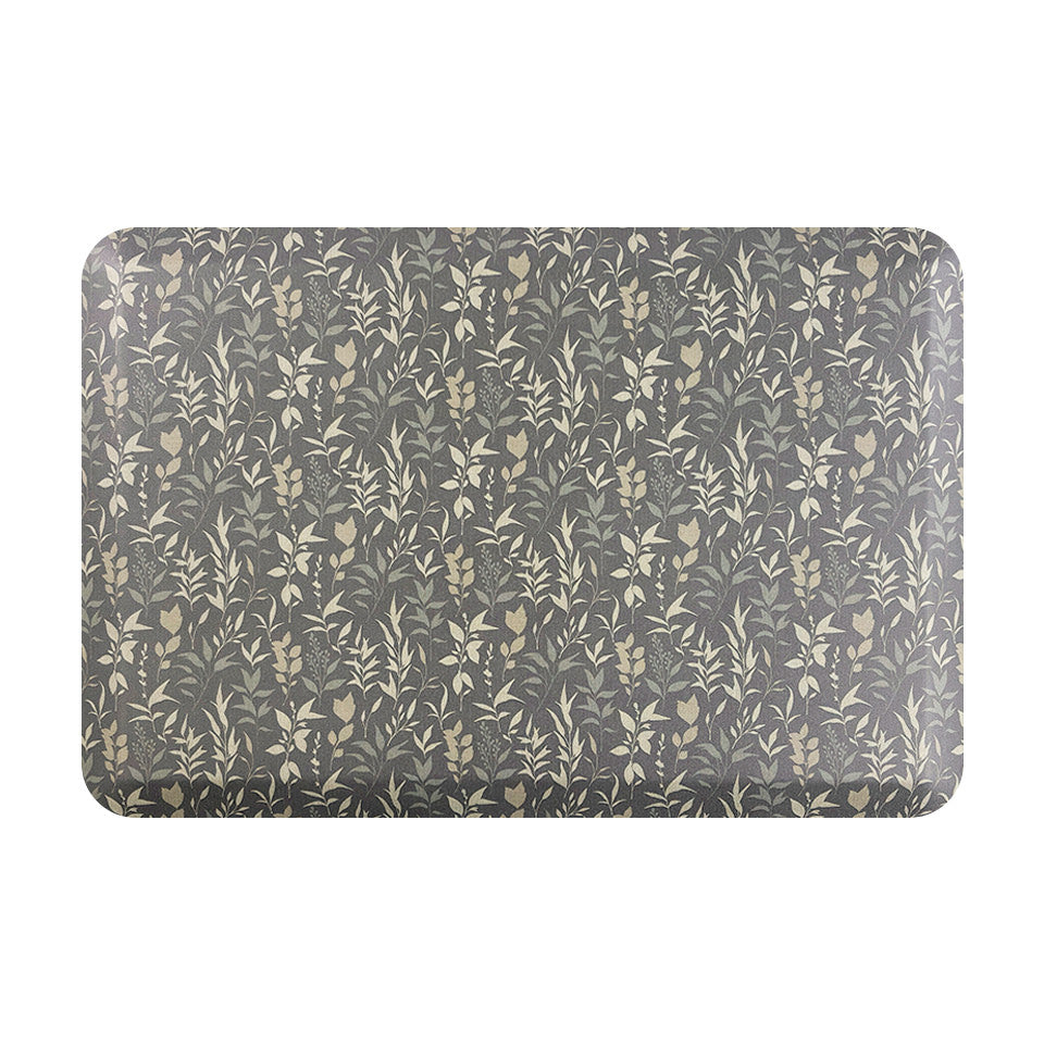 Happy Feet’s Ditsy Floral anti-fatigue small mat with a repetitive floral design on a textured grey background.