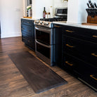 Traditional deep brown leather on a Happy Feet comfortable, anti-fatigue runner mat placed in the kitchen