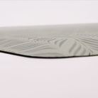 Up close corner image of the Featherbone anti-fatigue mat, showing the whimsical feather pattern and beveled edge.