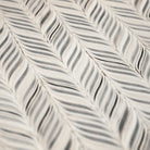 Detailed surface shot of featherbone's whimsical, feather design on a wipeable surface