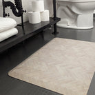 Happy Feet Herringbone standard mat in a bathroom for standing comfort.