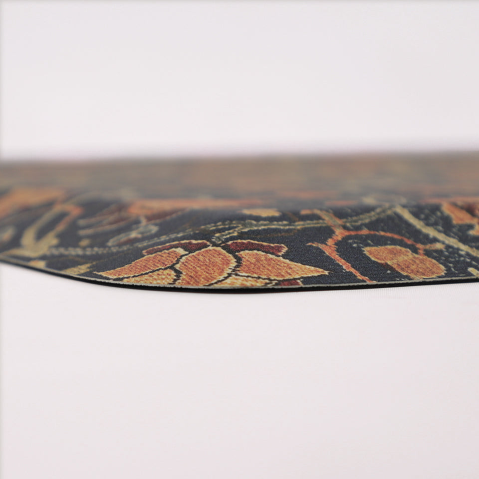 Corner image of the 5/8" thick anti-fatigue Happy Feet mat. Close-up of Holland Park's ornate floral pattern of a deep blue base and an array of browns, reds, oranges, and greens.