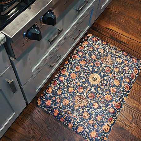 Durable and comfortable Happy Feet Anti-Fatigue mat featuring a floral medallion pattern placed in front of kitchen range top.