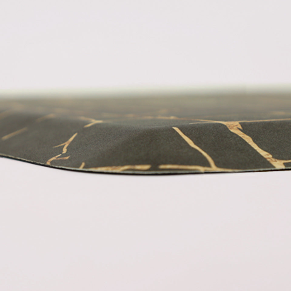 Corner image of anti-fatigue Kintsugi mat, surface of distressed greens and cracks of gold