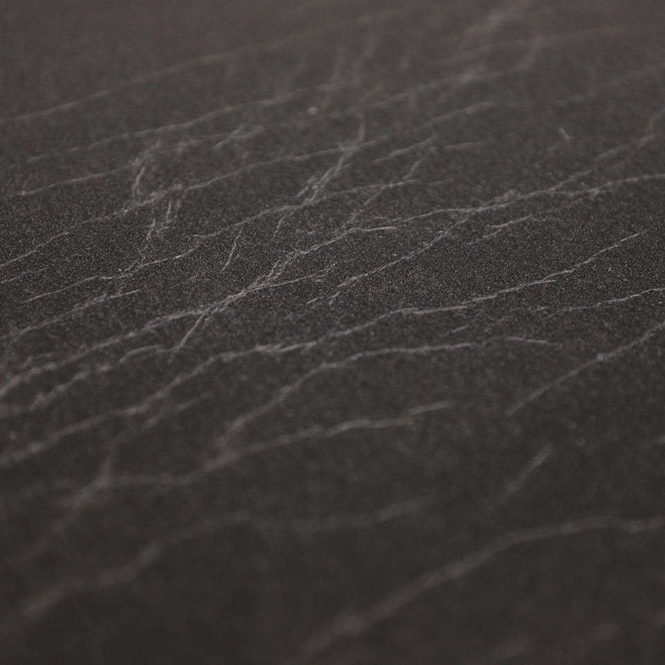 Detail image of Happy Feet's leather surface in ebony with a water-resistant, wipeable surface