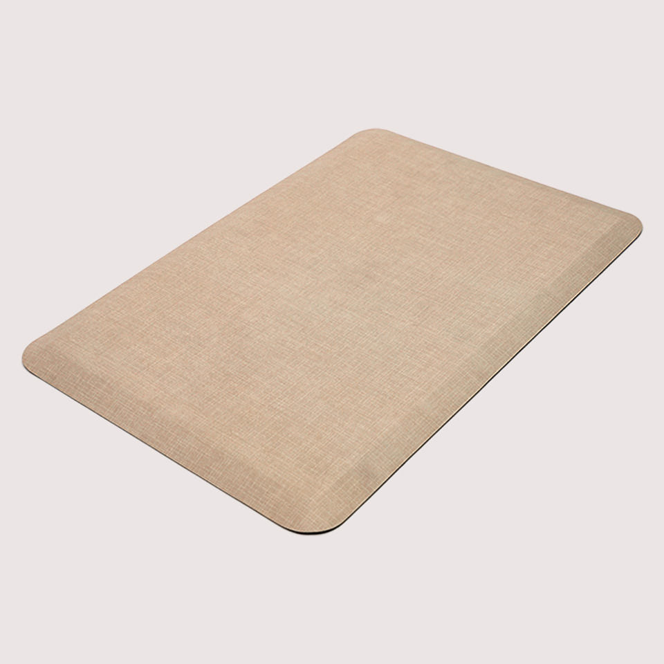 Happy Feet Linen mat in sand with beveled edging and a smooth, wipeable surface!